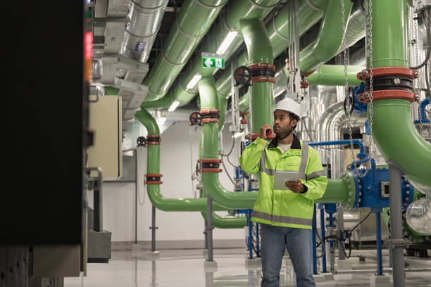 istock Technician worker working in chiller plant room. 2181524598