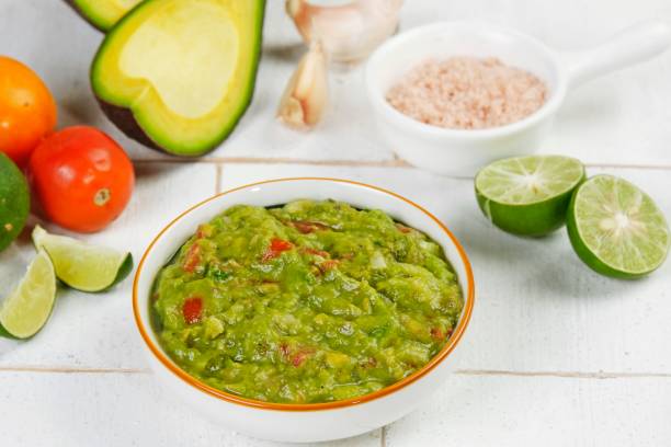 istock Fresh guacamole served in a white bowl, 2181528795