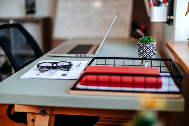 Office desk with laptop computer on top