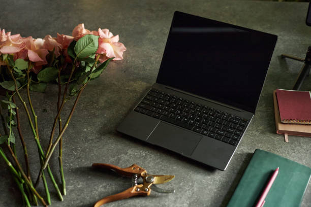 Composition of Open Laptop with Flowers