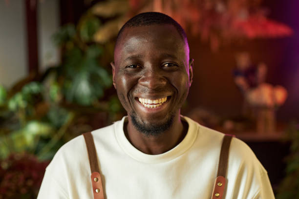 istock Black Man Enjoying Work in Flower Shop 2181531623