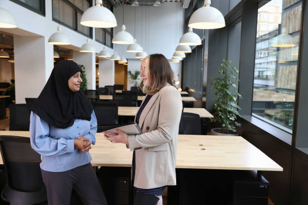 istock Two businesswomen discussing in office 2181532243