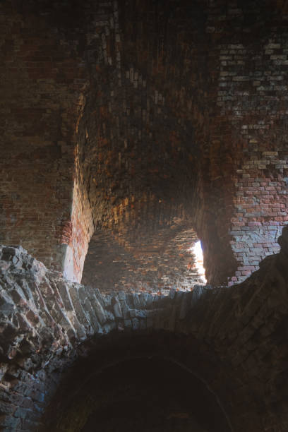 The dilapidated Bobruisk fortress is made of red brick inside. Sunlight inside