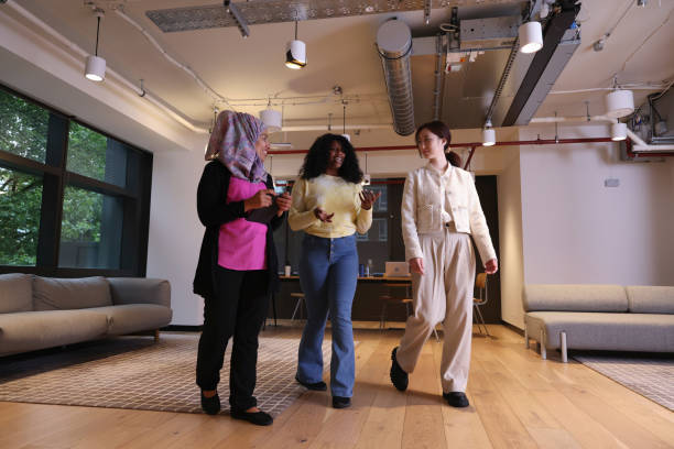 istock Diverse group of businesswomen walking through office 2181533040