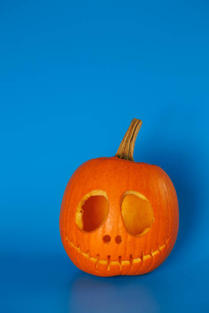 Empty Pumpkin Head on Blue Background. Halloween Holiday Concept.