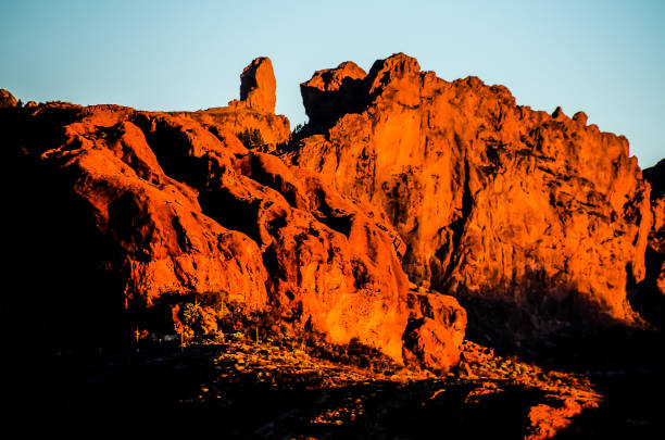 istock A mountain range with a large rock formation in the foreground 2181544041