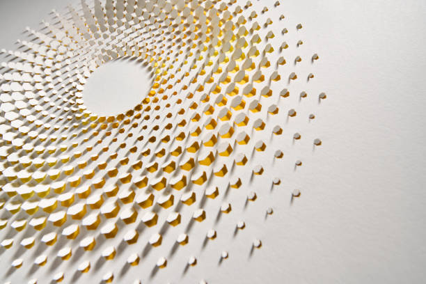 Native image size: 7952 x 5304. This close-up image captures an intricate paper cutout artwork resembling a sun mandala, meticulously crafted with hexagonal and circular cutouts. The design reveals a subtle yellow gradient beneath, creating a warm, radiant effect that suggests sunlight filtering through the layers. Shadows cast by the raised paper elements add a three-dimensional quality, enhancing the depth and texture of the piece. Set against a clean white background, this artwork evokes a sense of calm and natural beauty through its minimalistic yet detailed structure.