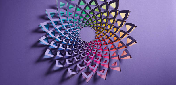 istock Floral Mandala Paper Cutout with Spiral Triangle Pattern and Rainbow Gradient on Purple Background 2181553224