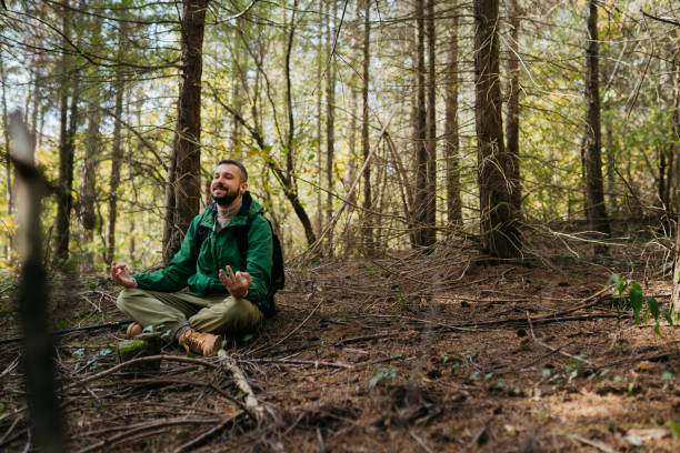 istock Meditation in the middle of the forest 2181557473