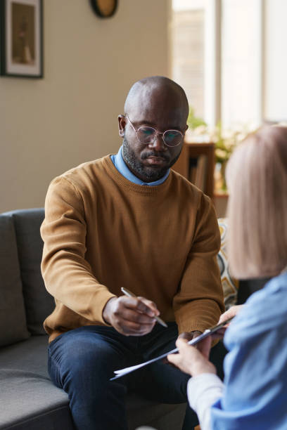 istock Black Man Signing Agreement 2181559319
