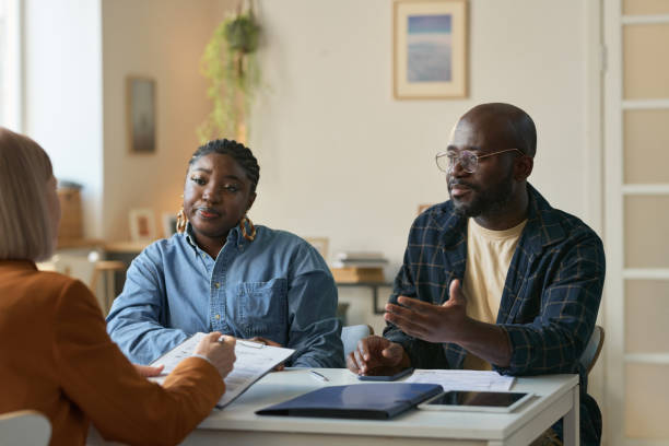 istock Black Couple Talking to Insurance Agent 2181559383