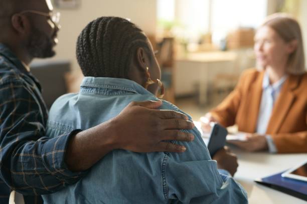 istock Black Couple Embracing During Consultation 2181559414