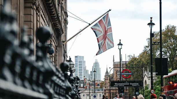 Regent Street, London, United Kingdom, May 4, 2025. Union jack flags hung across street in celebration of VE Day. Buildings in background. Outdoors on a spring day