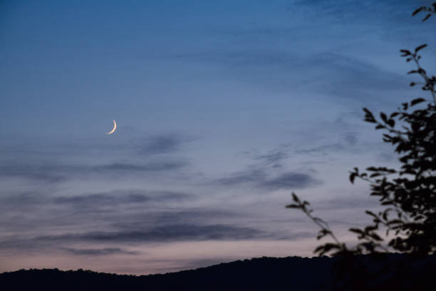 istock Crescent moonrise at dusk over mountains 2181561558