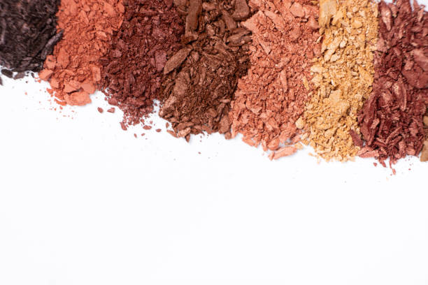 istock Scattered eye shadows in different shades. Cosmetics texture, white background. 2181561660