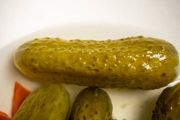 Close-up of cucumber gherkins on a 360 degree rotating bowl,4k