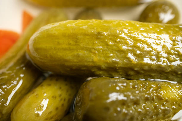 Close-up of cucumber gherkins on a 360 degree rotating bowl,4k