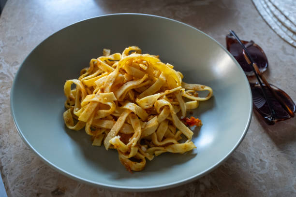 istock pasta with creamy tomato sauce on a green plate 2181563938