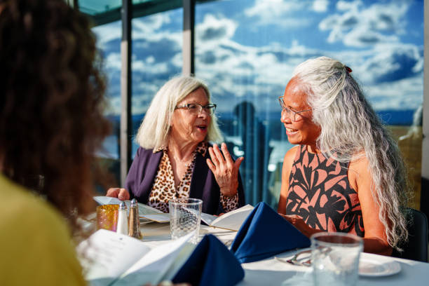 istock Active senior women at dinner together 2181566876