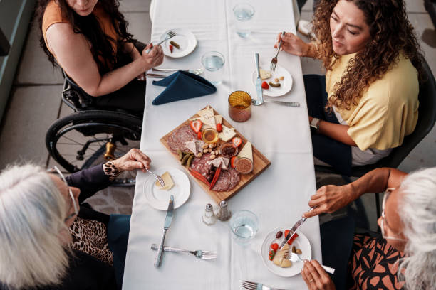 Group of women sharing appetizer platter at upscale restaurant