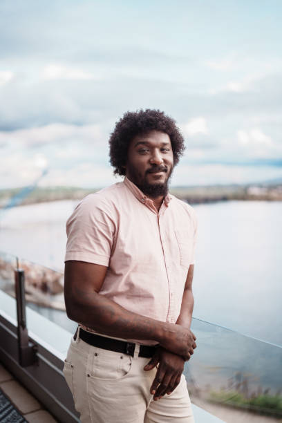 istock Multiracial man on rooftop terrace overlooking river 2181566976