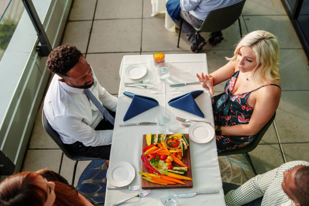 istock Multiracial group of friends  dining outdoors at upscale restaurant 2181567041