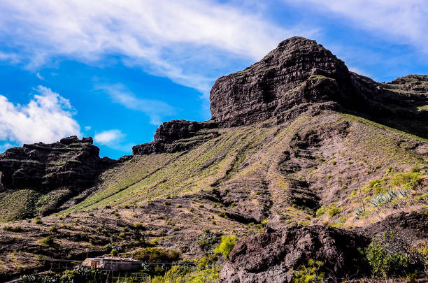 istock A mountain with a rocky hillside and a few trees 2181568543