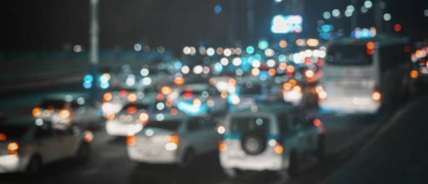 istock Blurred car traffic light at night city. Traffic jam in evening rush hour. 2181569497