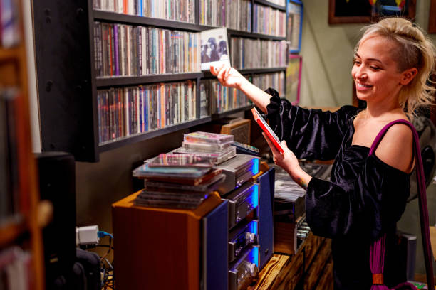 Young woman browsing CDs in a retro-style record store
