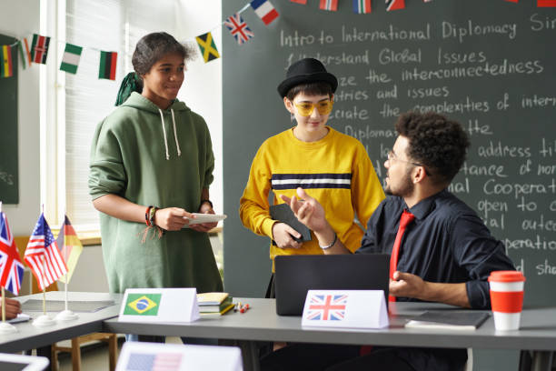 istock Girls Talking to Teacher in Class 2181570243