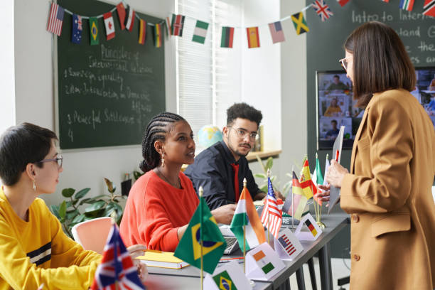 istock Female Teacher Talking to Students at School 2181570276