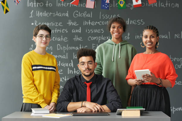 istock Teacher with Group of Students in Classroom 2181570292