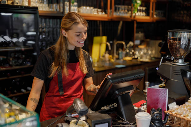 istock A barista is actively working at a bustling coffee shop that utilizes a modern POS system 2181570610