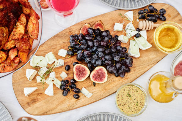 istock Wooden Charcuterie Board with Cheeses 2181572677