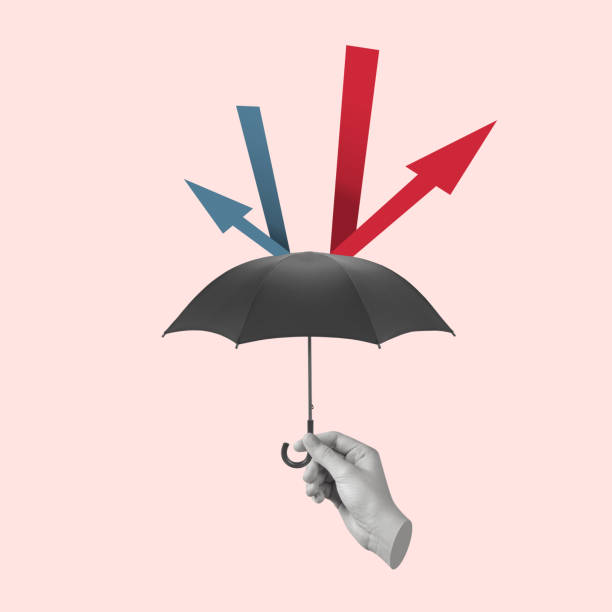 istock Hand holding an umbrella that protects from arrows aimed at it. 2181575617