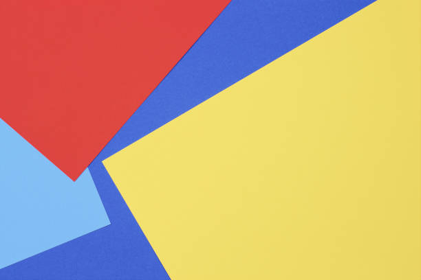 istock Creative abstract blue, red and yellow color geometric paper composition background, top view 2181576023