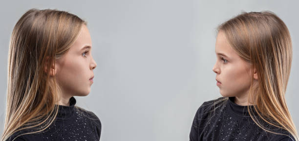 Preteen girl in dark turtleneck shirt contemplates her future self, facing doubt and uncertainty