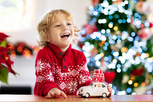 istock Child with Christmas present. Kid with Xmas gift. 2181577872