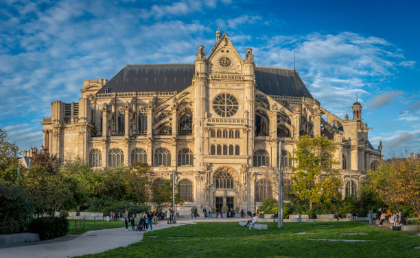 View of Church of Saint-Eustache from Nelson Mandela Garden at sunset Paris, France - 10 28 2024: View of Church of Saint-Eustache from Nelson Mandela Garden at sunset église saint eustache stock pictures, royalty-free photos & images