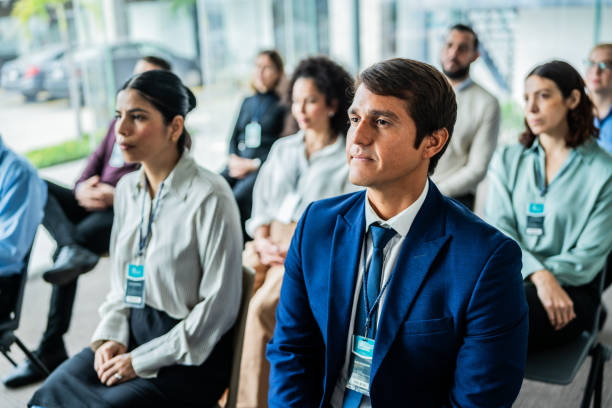 istock Mid adult man during seminar at office 2181581981
