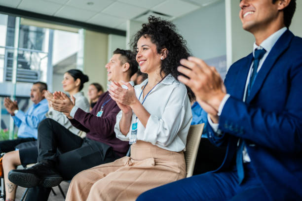 istock Coworkers applauding during seminar at office 2181581992