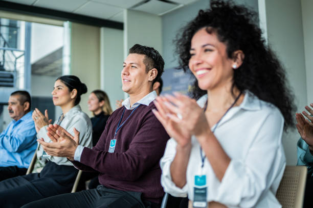 istock Coworkers applauding during seminar at office 2181582018
