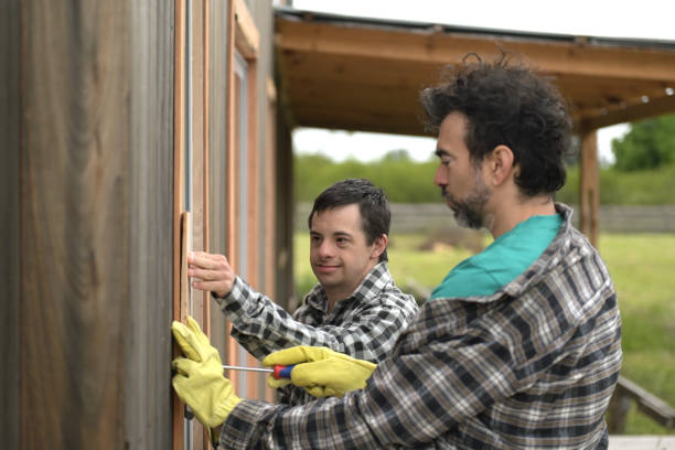 istock man with disabilities and his brother nailing wood 2181584032