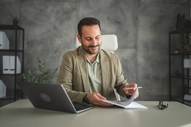 istock adult businessman work on new project at notebook in office 2181584844