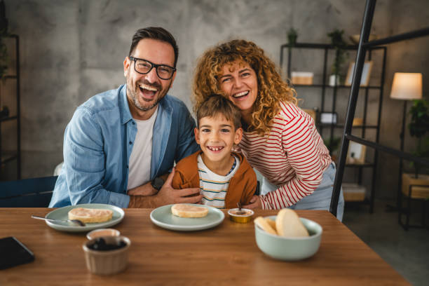 istock portrait of mother, father and son while have breakfast together 2181586021