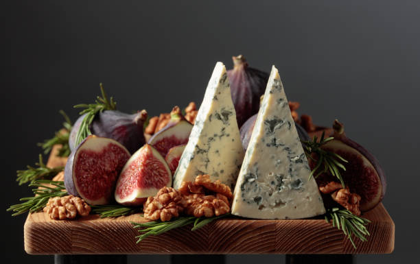 istock Blue cheese with figs, walnuts, and rosemary. 2181587532