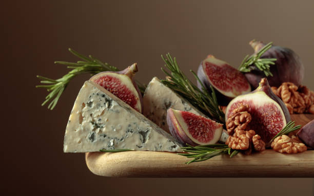 istock Blue cheese with figs, walnuts, and rosemary. 2181587533