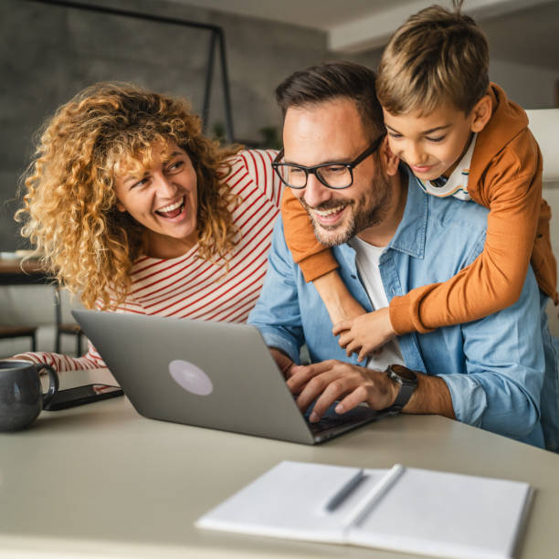 istock father work from home whit his wife and son 2181587738