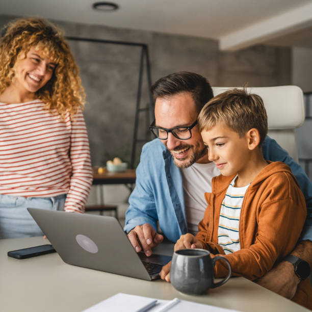 istock father work from home whit his wife and son 2181589078