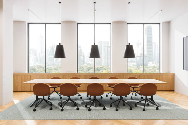 istock Light conference interior with table and seats, tv display and panoramic window 2181591830
